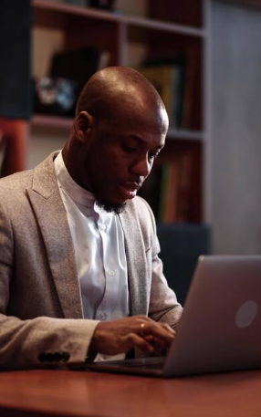 Nigerian lawyer using legal practice management software Nigeria on a laptop